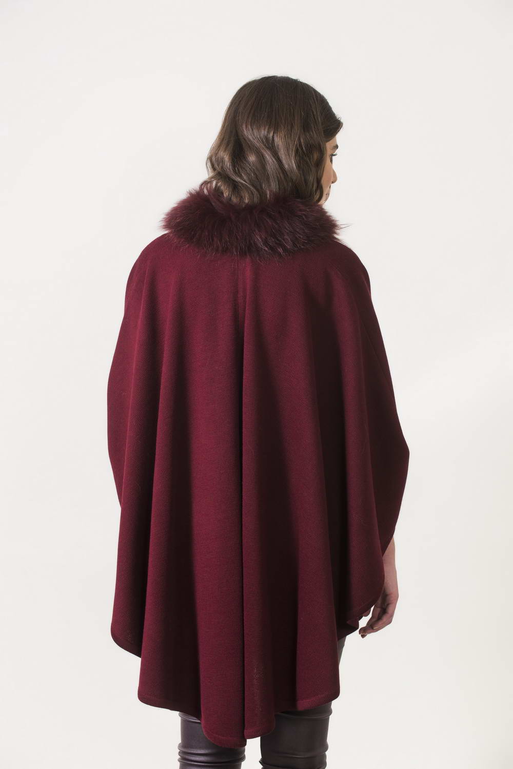 Burgundy knitting cape with fur trimming. One size.