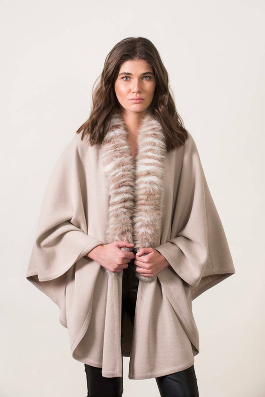 Beige knitting cape with fox trimming. One size.
