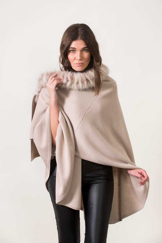 Beige knitting cape with fox trimming. One size.