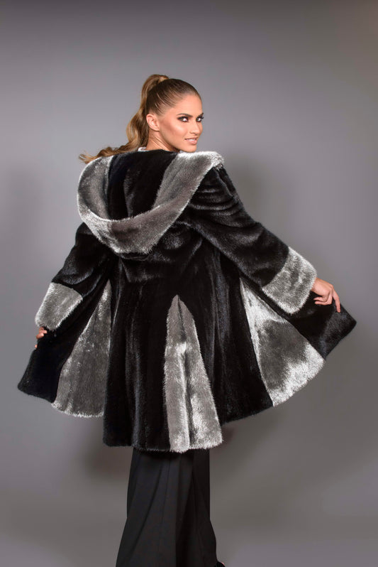 Black hooded Mink coat with silver trim.