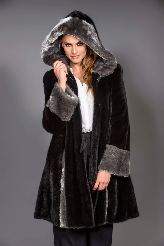 Black hooded Mink coat with silver trim.