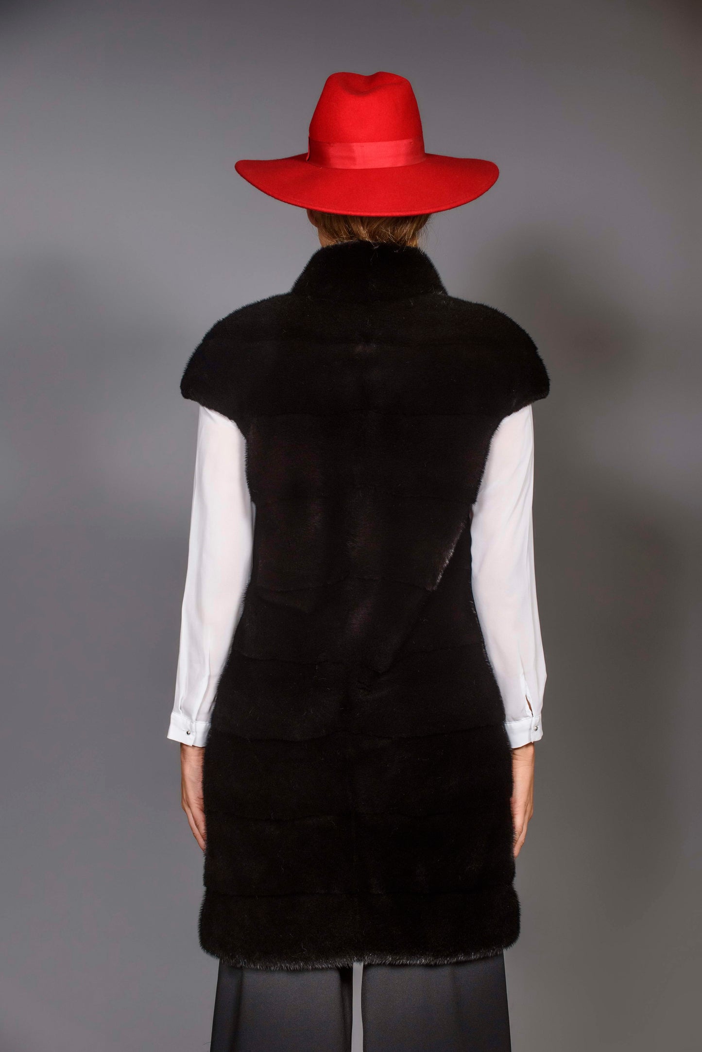 SAGA ROYAL long vest with pelts across diagonally arranged