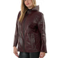 Woman wearing a burgundy leather jacket on a white background
