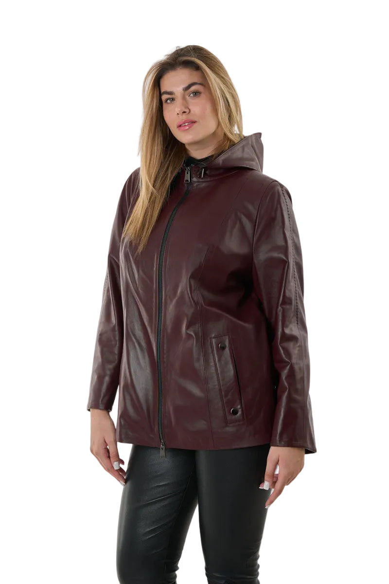 Woman wearing a burgundy leather jacket on a white background