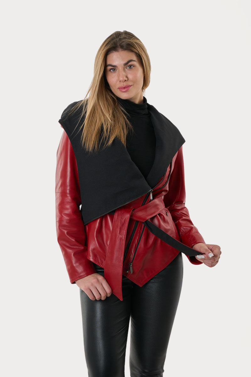 Woman wearing a red leather jacket with a black collar on a white background