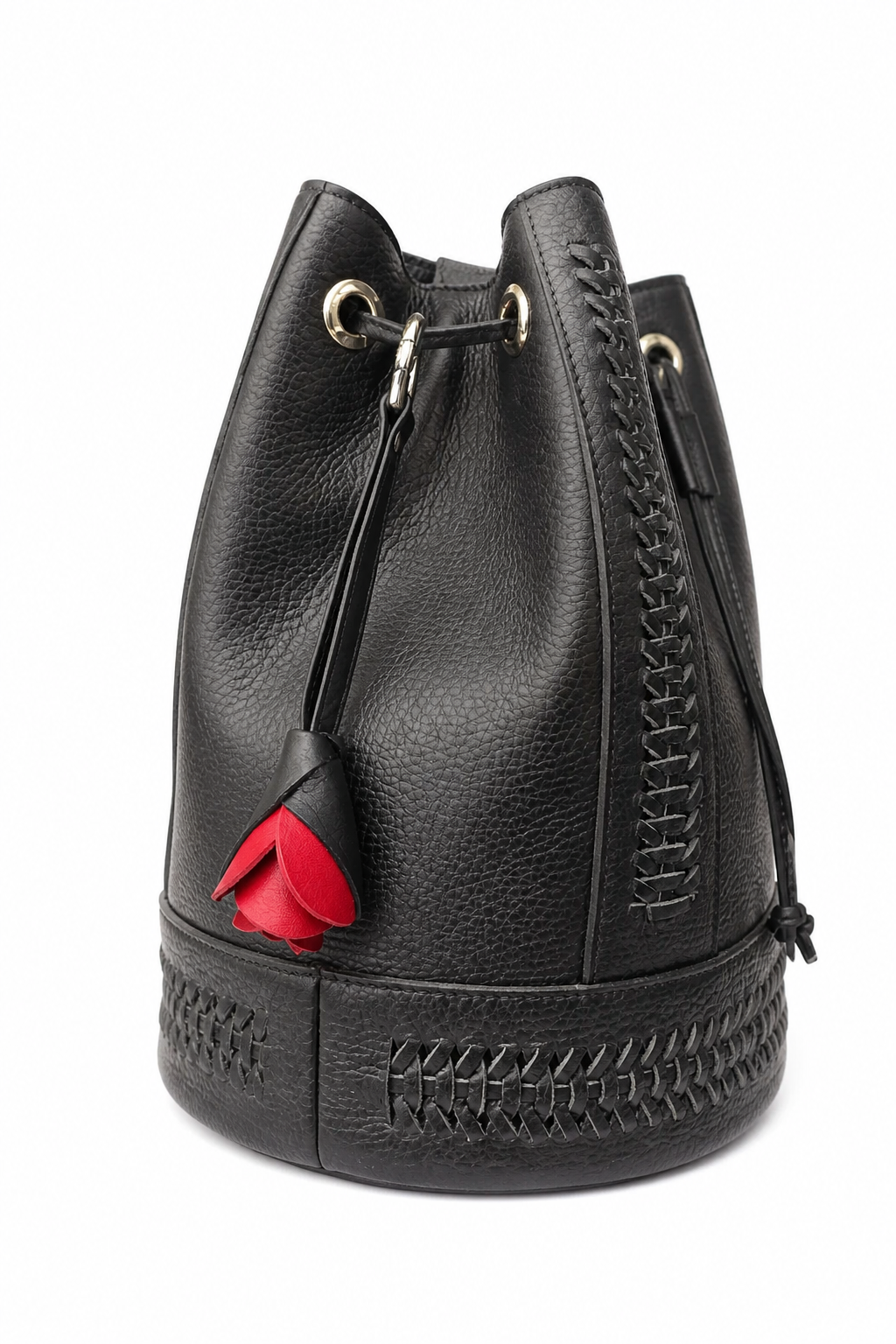 Black pebbled leather bucket bag with a drawstring closure, decorative stitching, a thick textured sole, and a red heart-shaped leather charm.