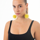 Lime Green Fur Pom Pom Earrings in stainless steel hoops